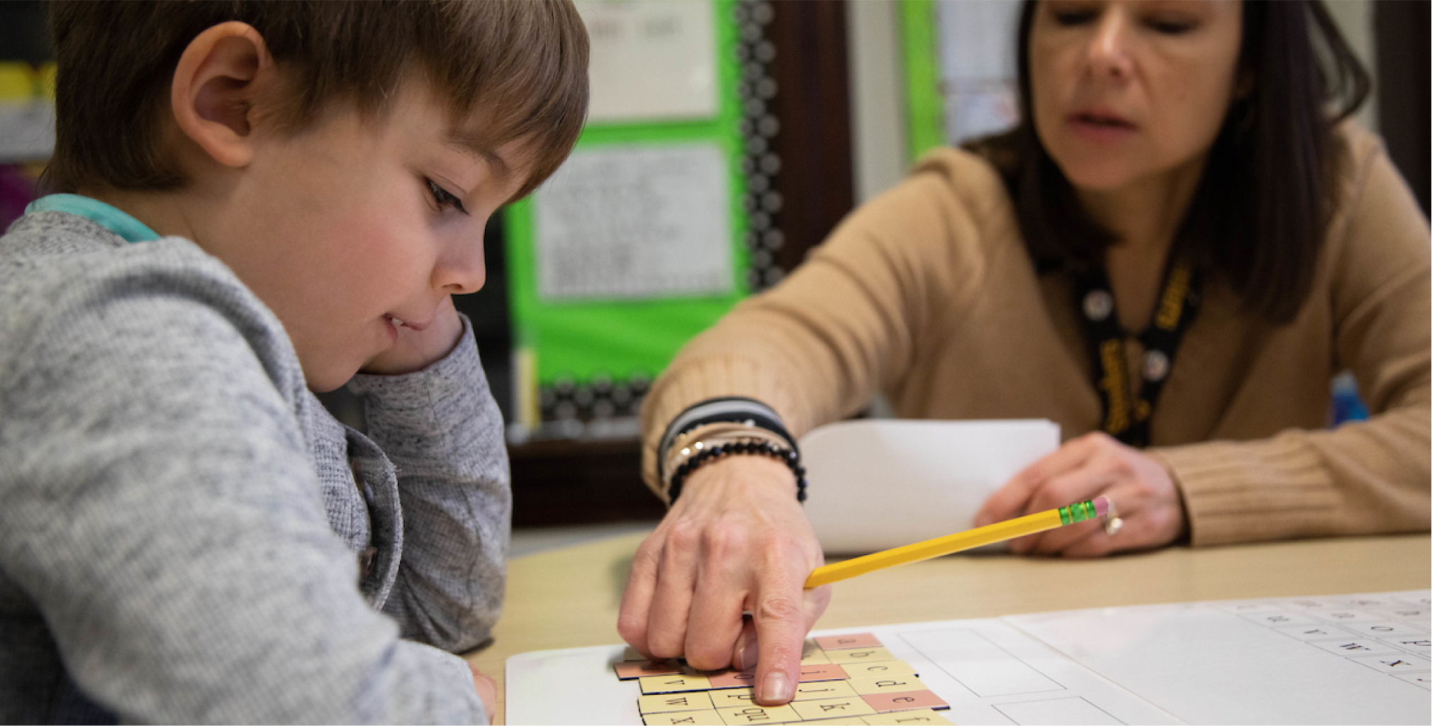 Student working with child