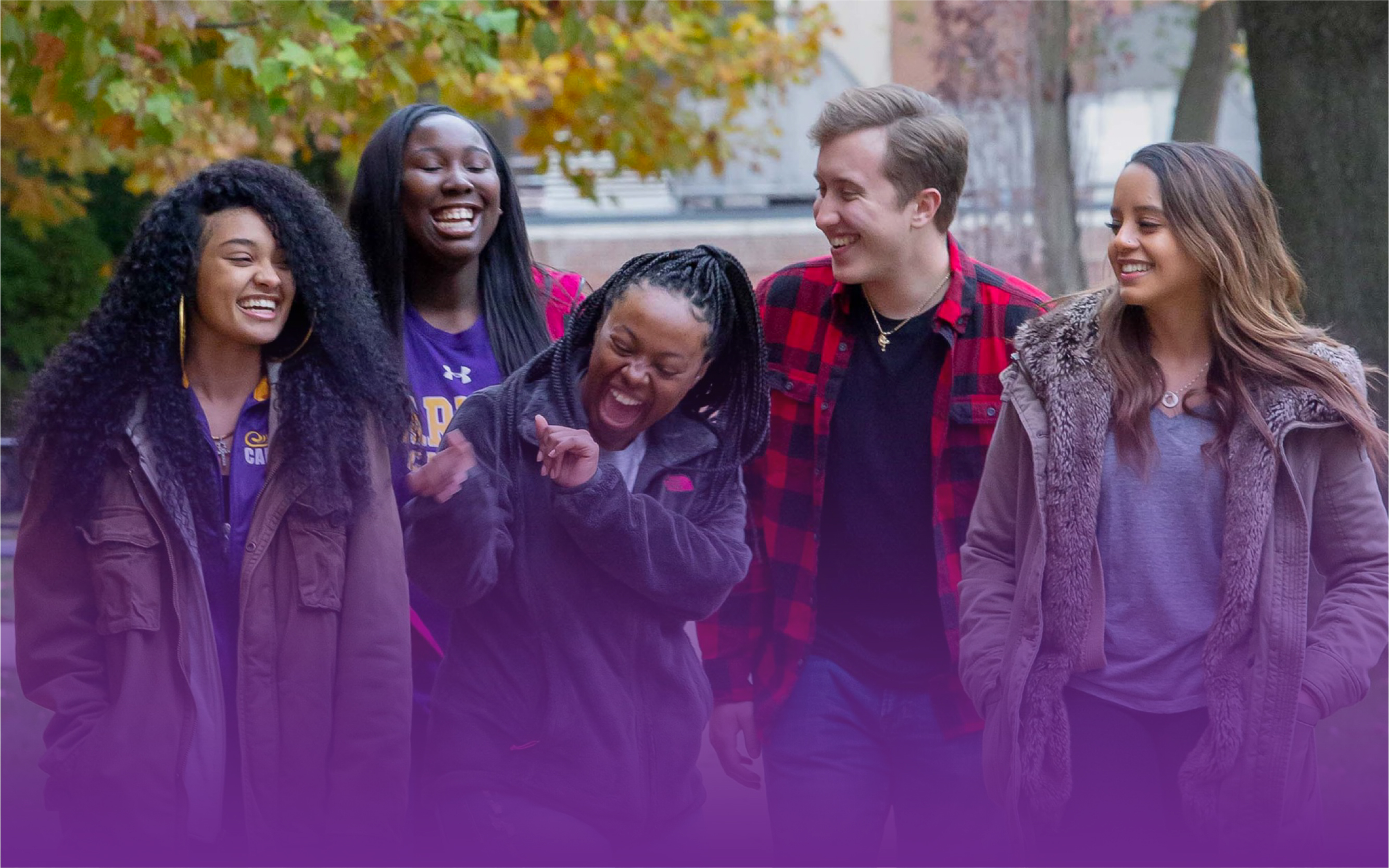Group of students talking and laughing.